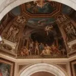 Ornate Renaissance ceiling with detailed frescoes.