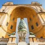 Vatican Museum courtyard with pinecone sculpture and arch